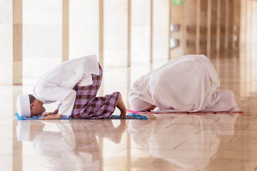 Young Couple Doing Salat with Prostrate Gesture